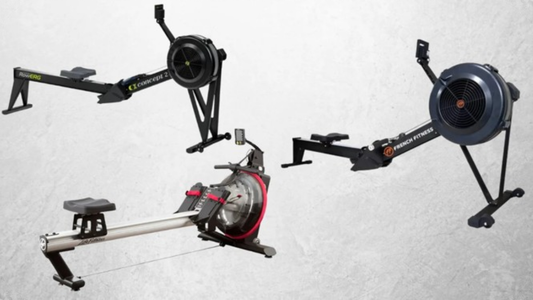 Three commercial rowing machines, including Concept2, French Fitness, and Lifecore models, displayed side by side on a light gray background for comparison.