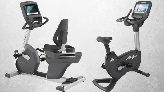 Matrix recumbent and Life Fitness upright exercise bikes positioned side by side, ideal cardio equipment for small home gyms.